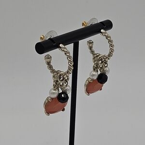 small gold tone hoop earrings with pink black faux pearl dangles